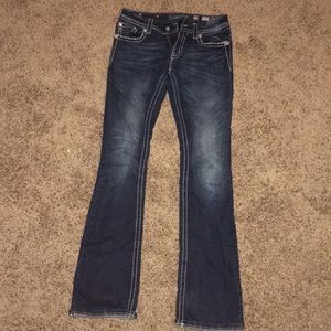Front view of the buckle jeans